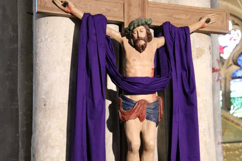 Jesus On Cross Statue With Purple Cloth Wallpaper