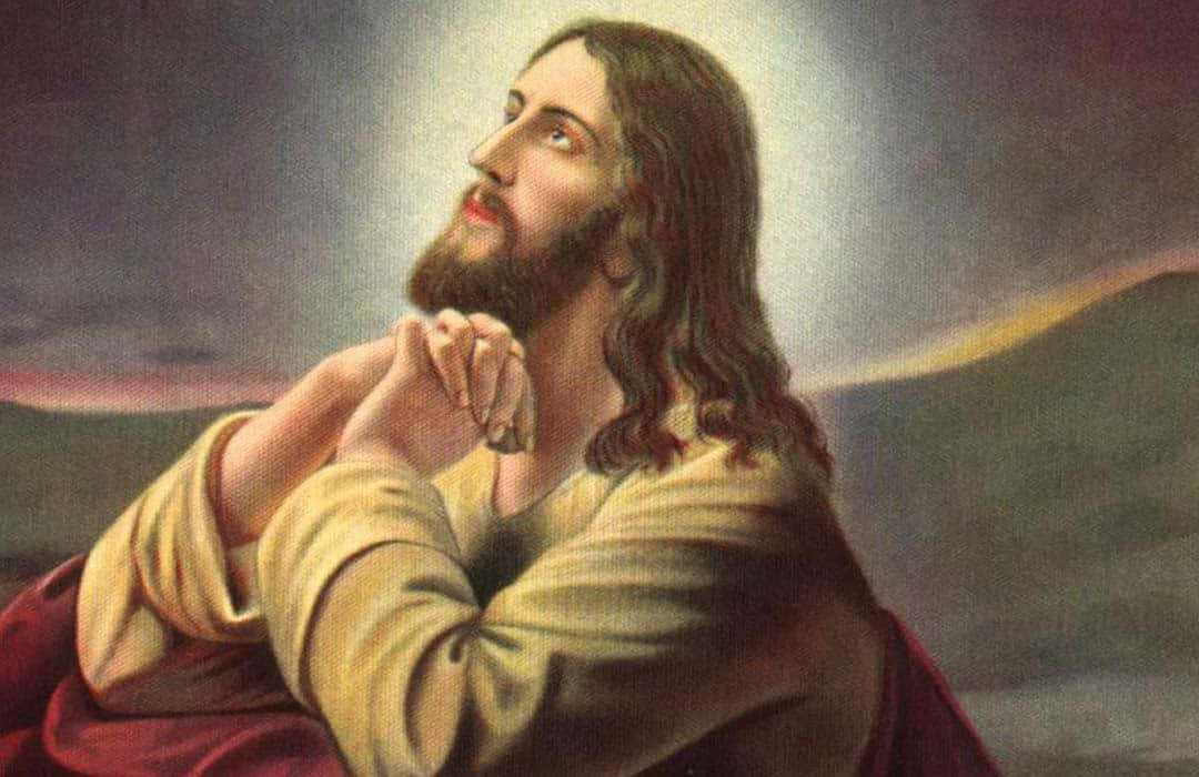 Jesus Praying With His Hands On His Knees Wallpaper