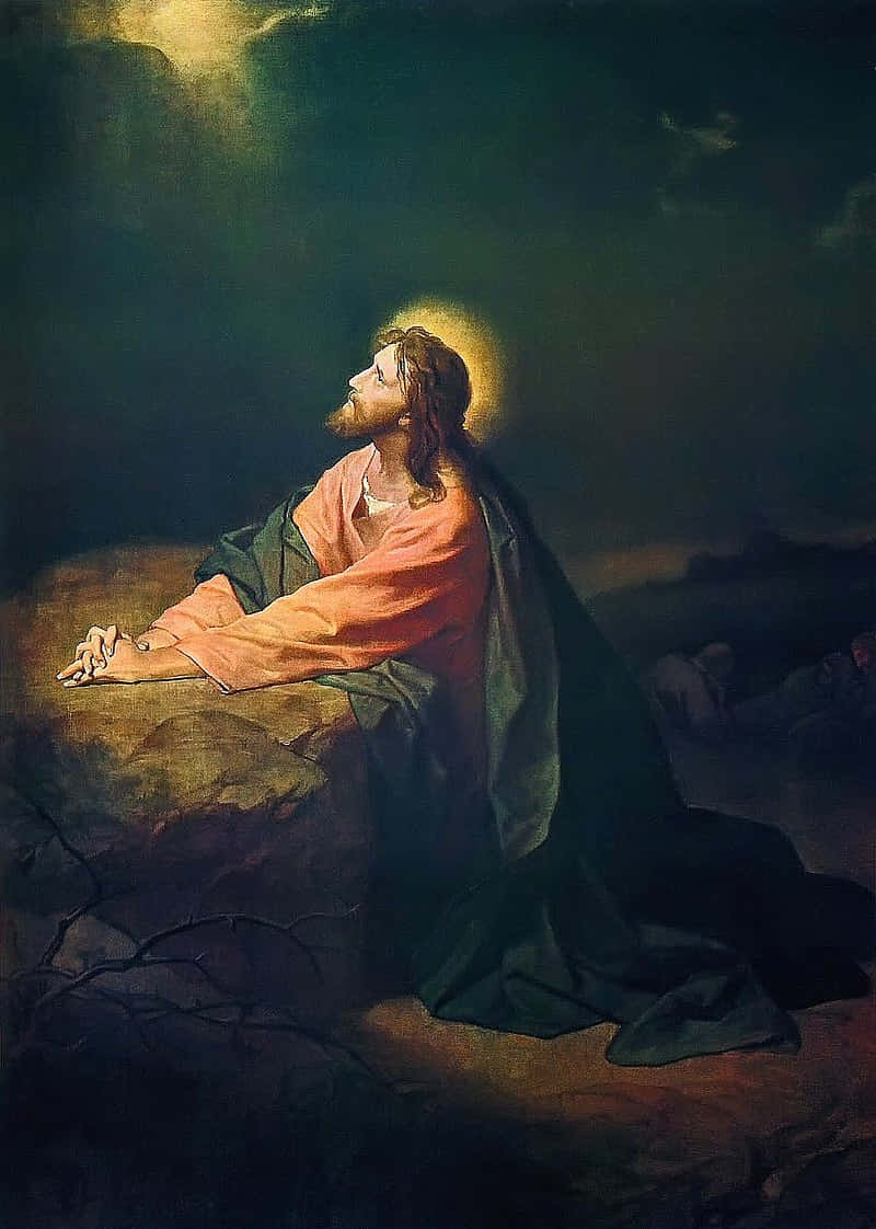 Jesusbetet In Einer Inspirierenden Szene. Wallpaper