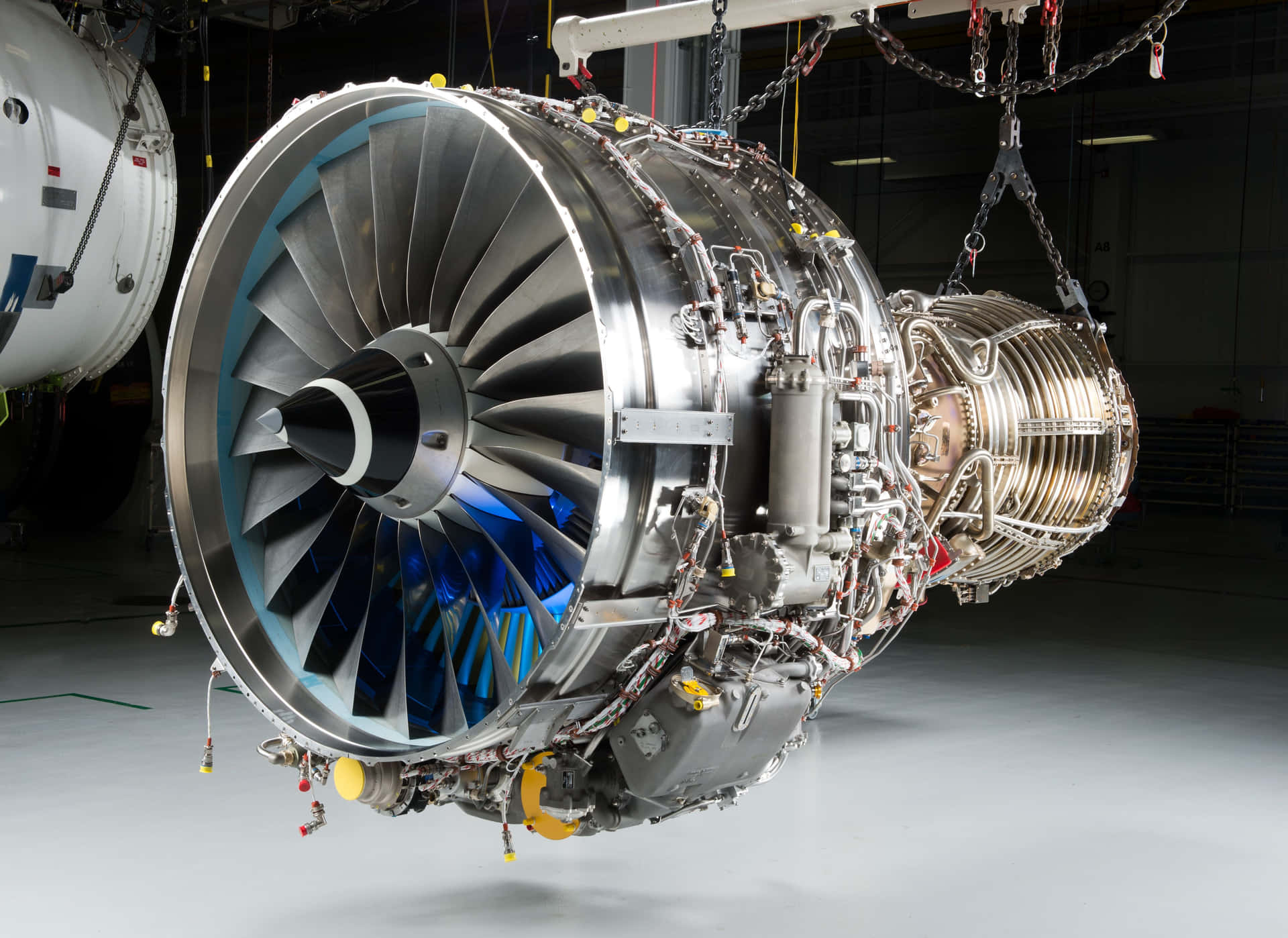 Caption: Close-up of a Powerful Jet Engine Wallpaper