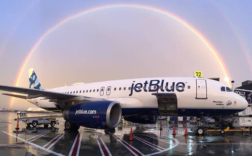 Jetblue Airways Plane Under A Rainbow Wallpaper