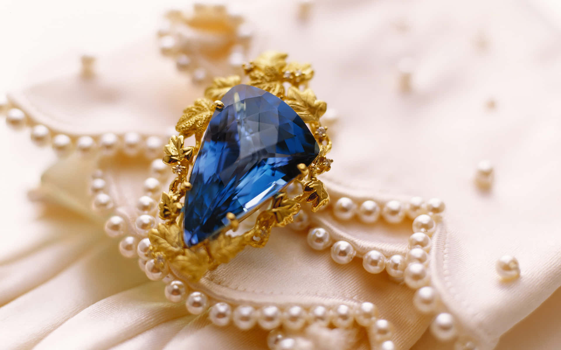 A Blue Sapphire Ring On A White Silk