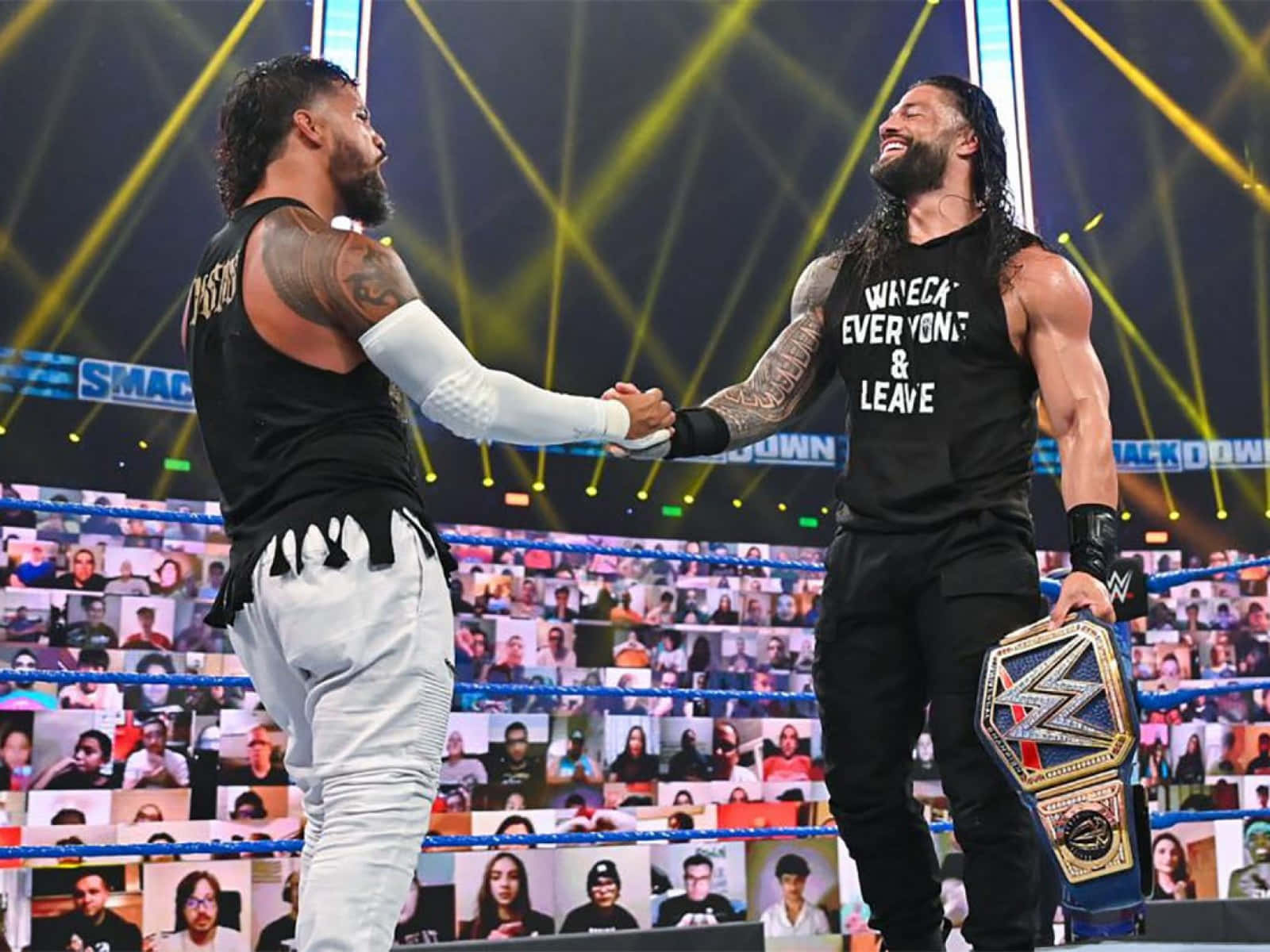 Jey Uso And Roman Reigns Handshaking Wallpaper