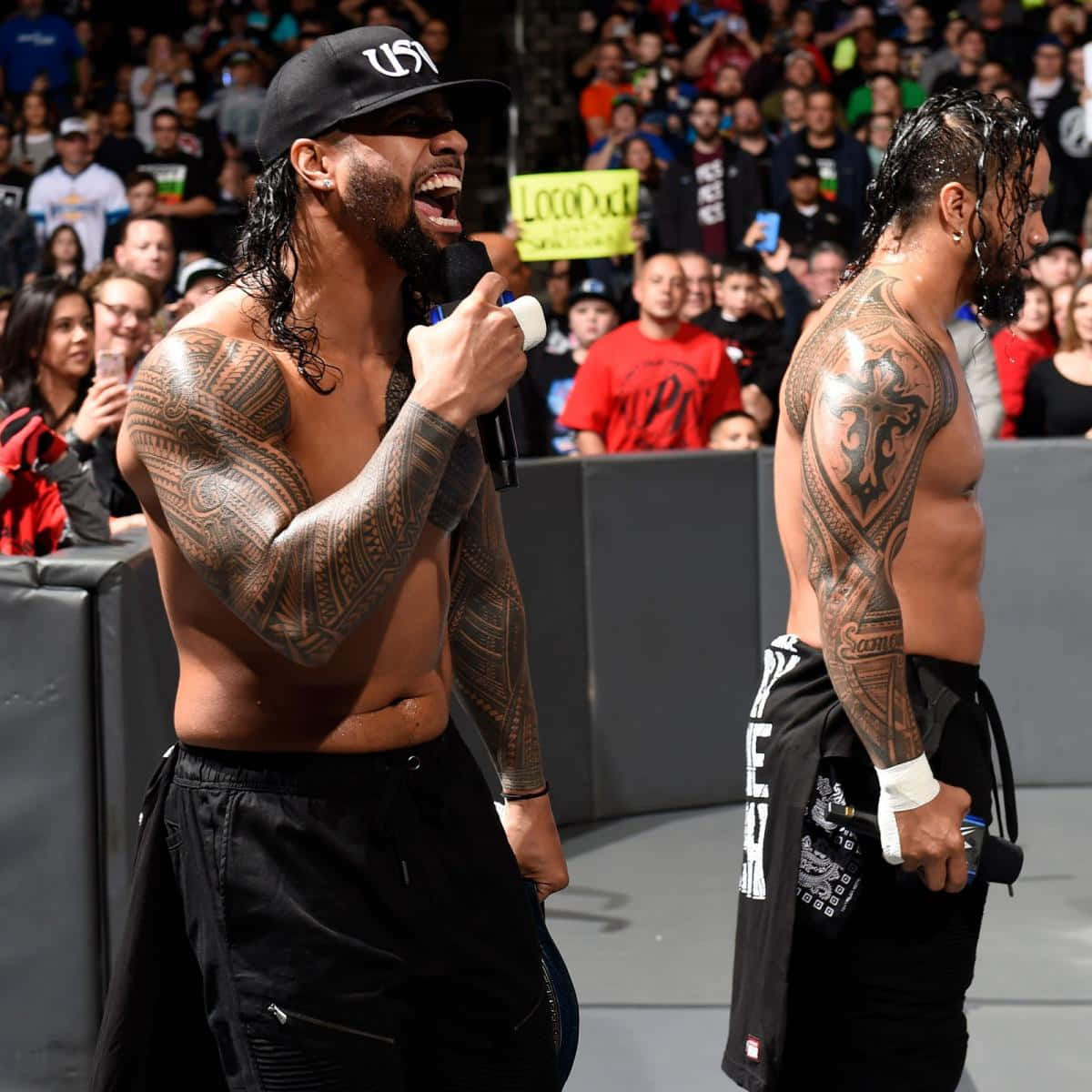 Jey Uso alongside his twin brother Jimmy Uso showcasing their brotherly bond in the ring. Wallpaper