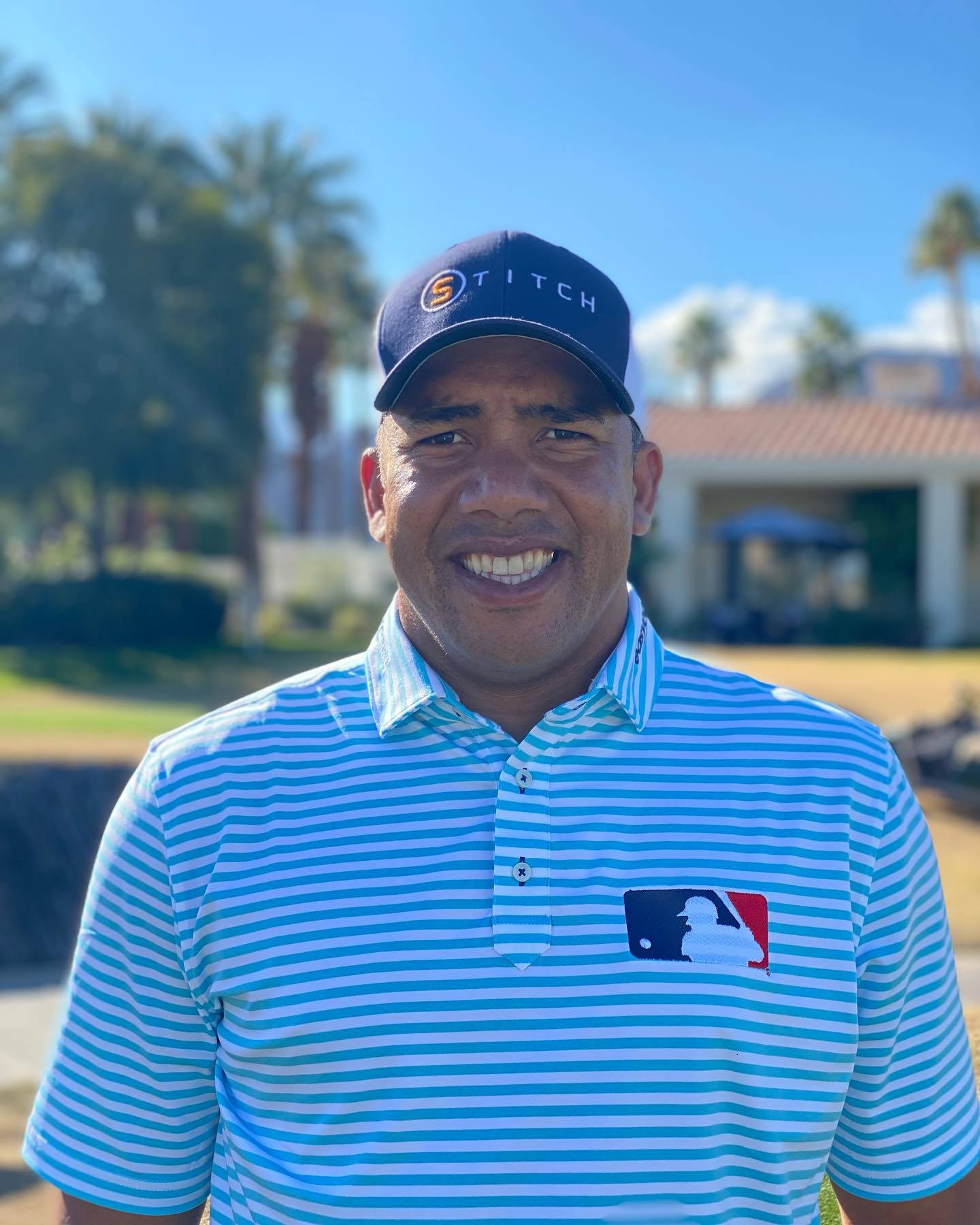 Jhonattan Vegas with a bright smile on the golf course Wallpaper