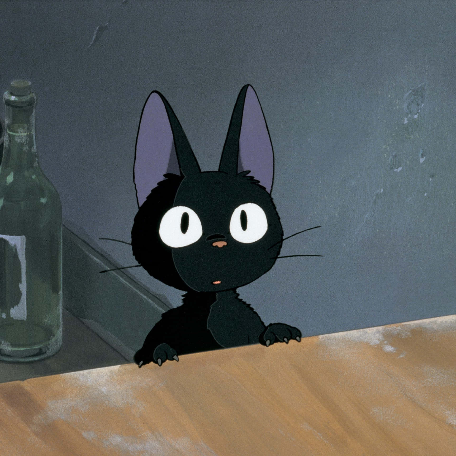 Jiji the black cat from Studio Ghibli's Kiki's Delivery Service sitting on a wooden branch Wallpaper