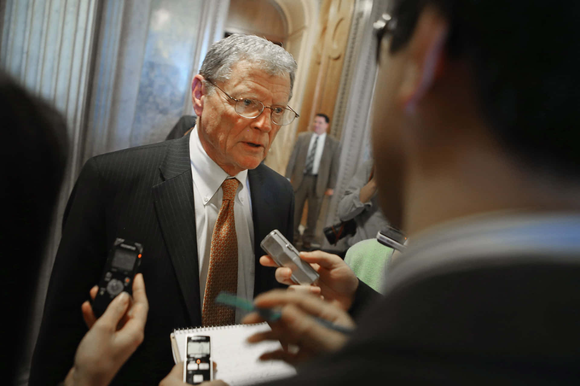 Jim Inhofe Surrounded By Interviewers Wallpaper