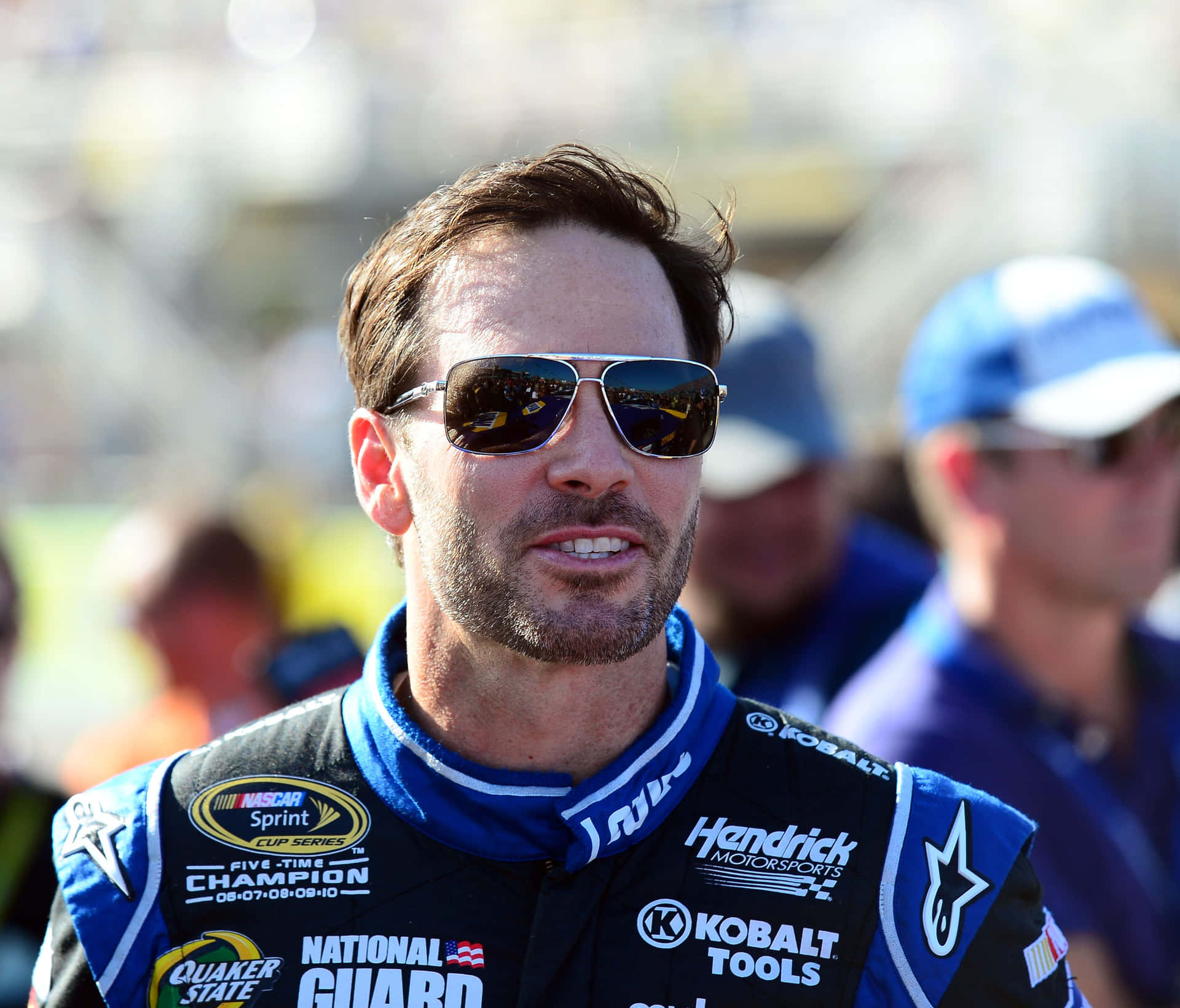 Jimmie Johnson racing on the tracks in his No. 48 car Wallpaper
