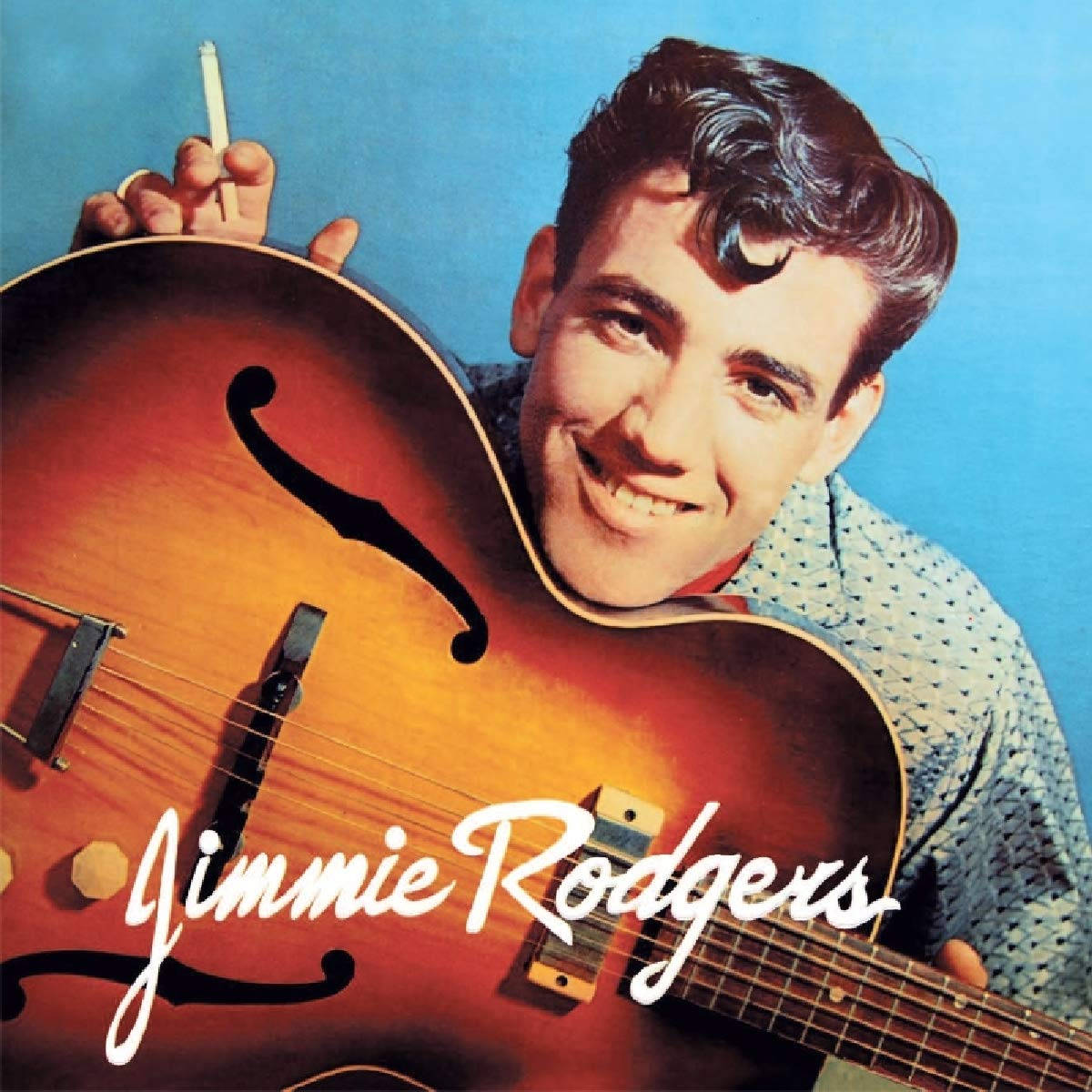 Jimmie Rodgers Modeling An Orange Guitar Wallpaper