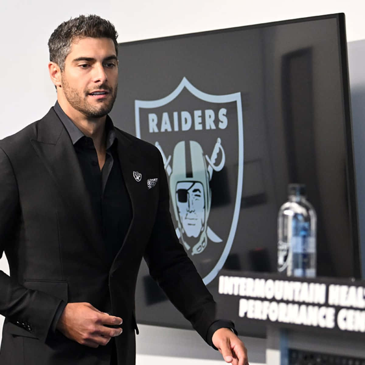 Jimmy Garoppolo striking a pose on the field Wallpaper