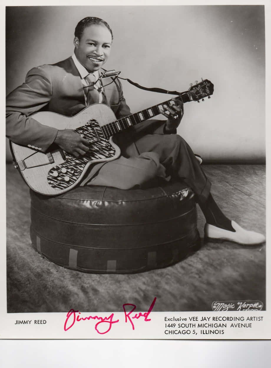 Jimmy Reed Sitting On A Couch Wallpaper