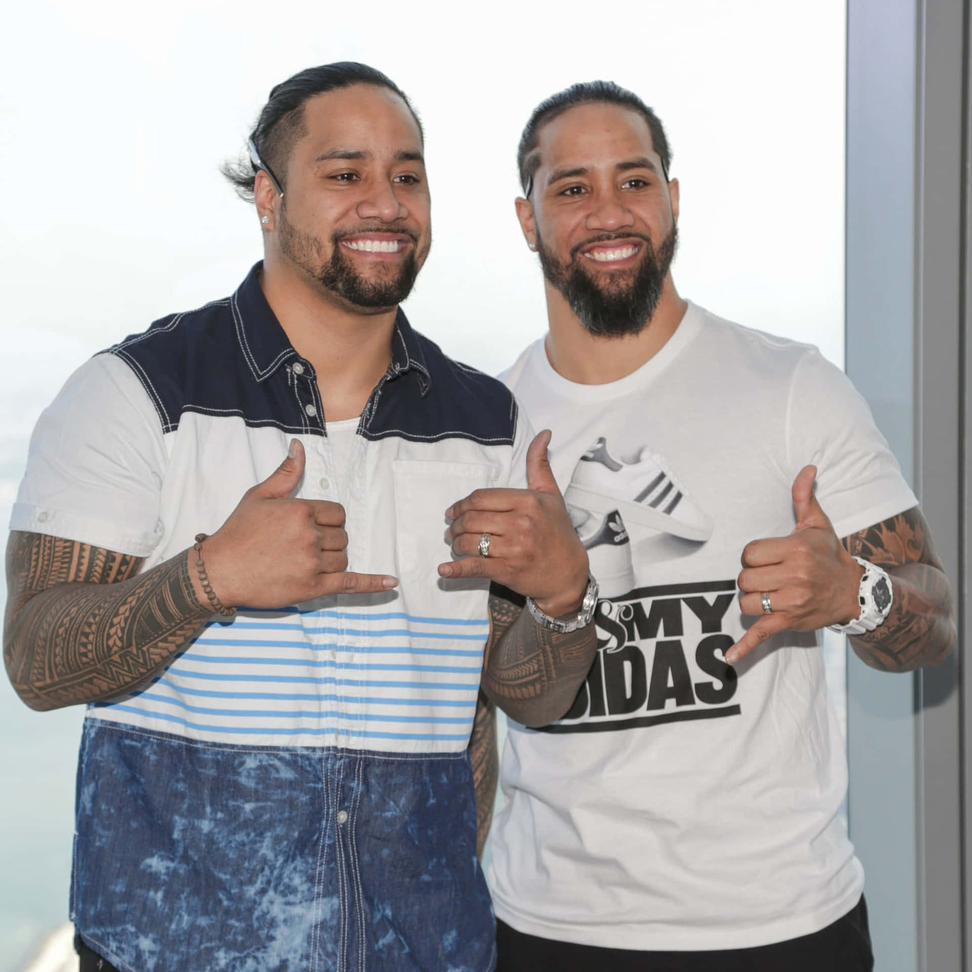 Caption: Dynamic - Jimmy Uso of The Usos in Action Wallpaper