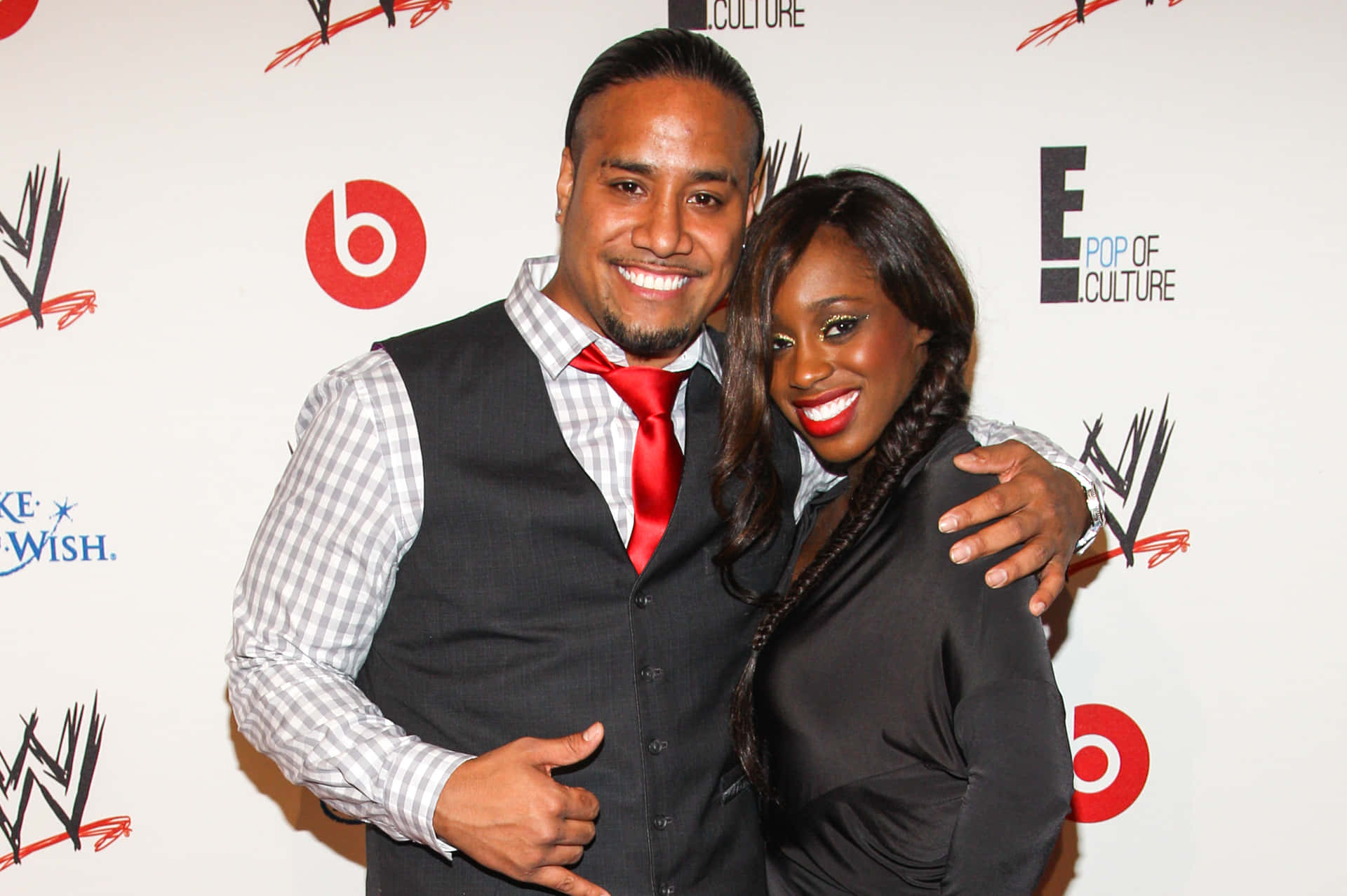 Caption: Power Couple Jimmy Uso with Wife Naomi - Smackdown Superstars Wallpaper