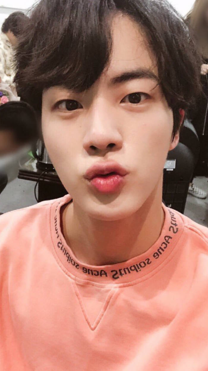 Jin BTS Cute Brown Hair And Salmon Shirt Wallpaper