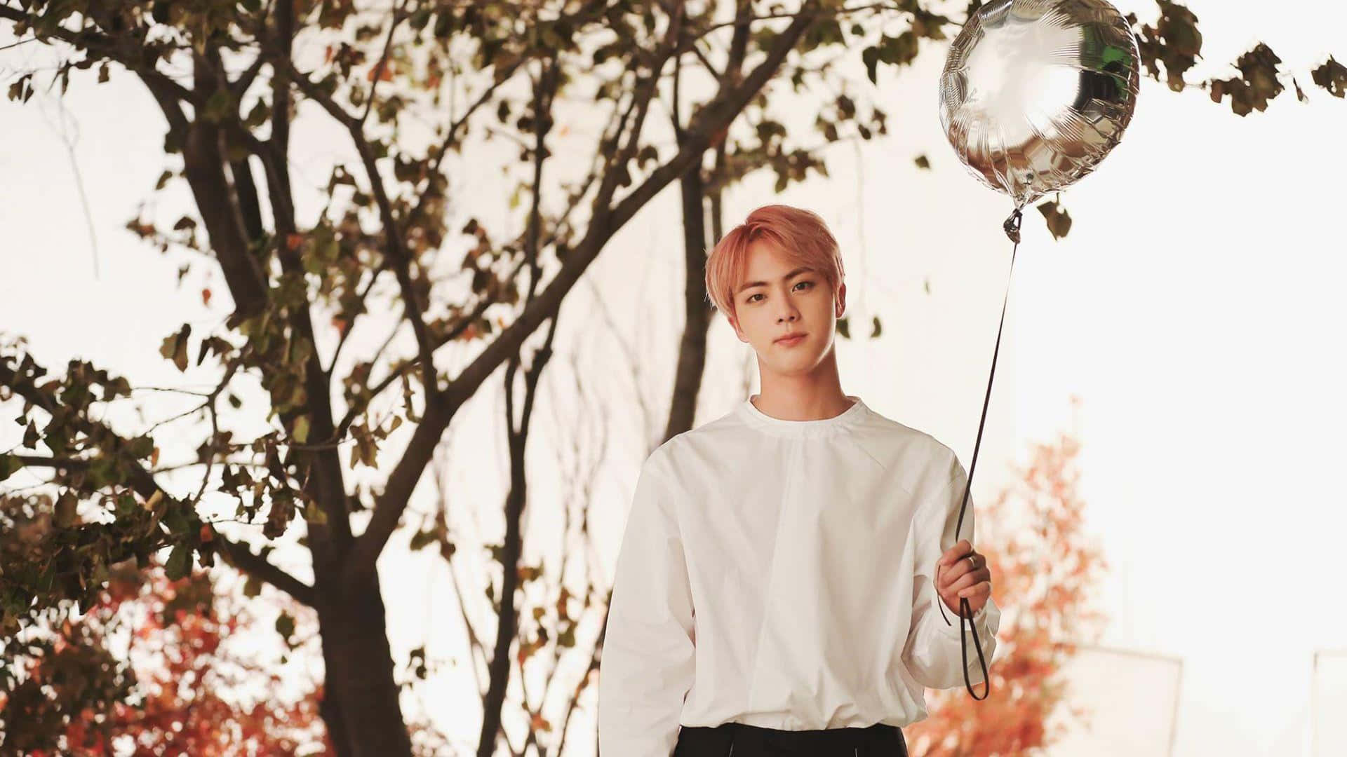 Jin BTS show off his bright personality.