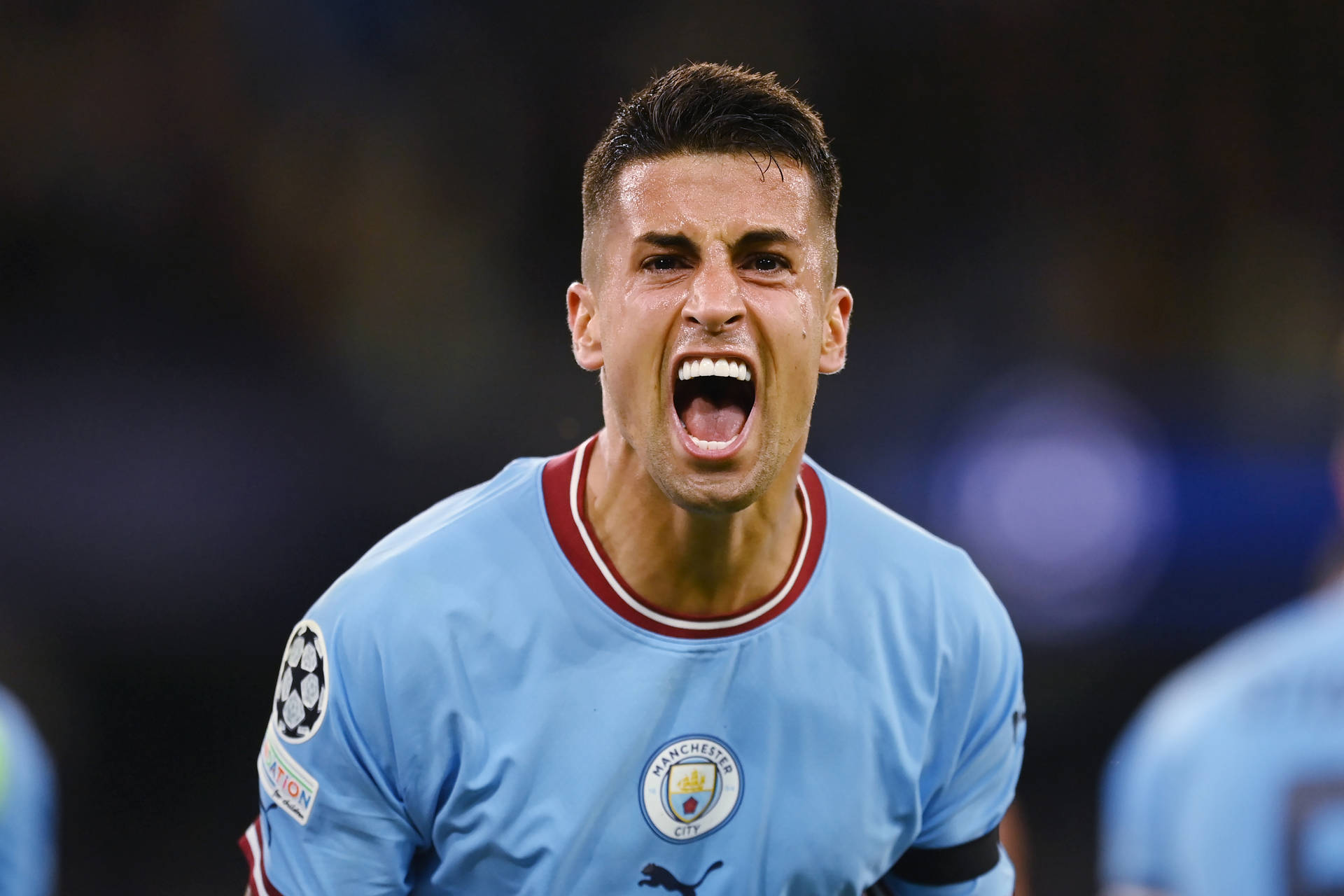 Joao Cancelo in Full Intensity on the Football Pitch Wallpaper