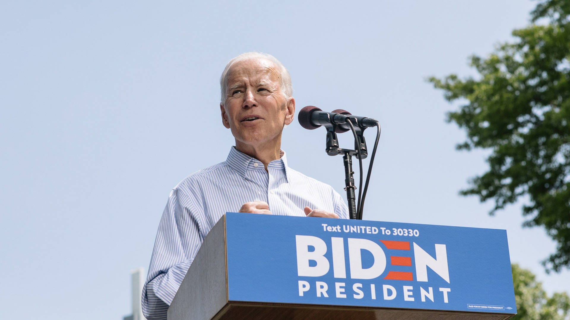Joe Biden delivers powerful speech on stage Wallpaper