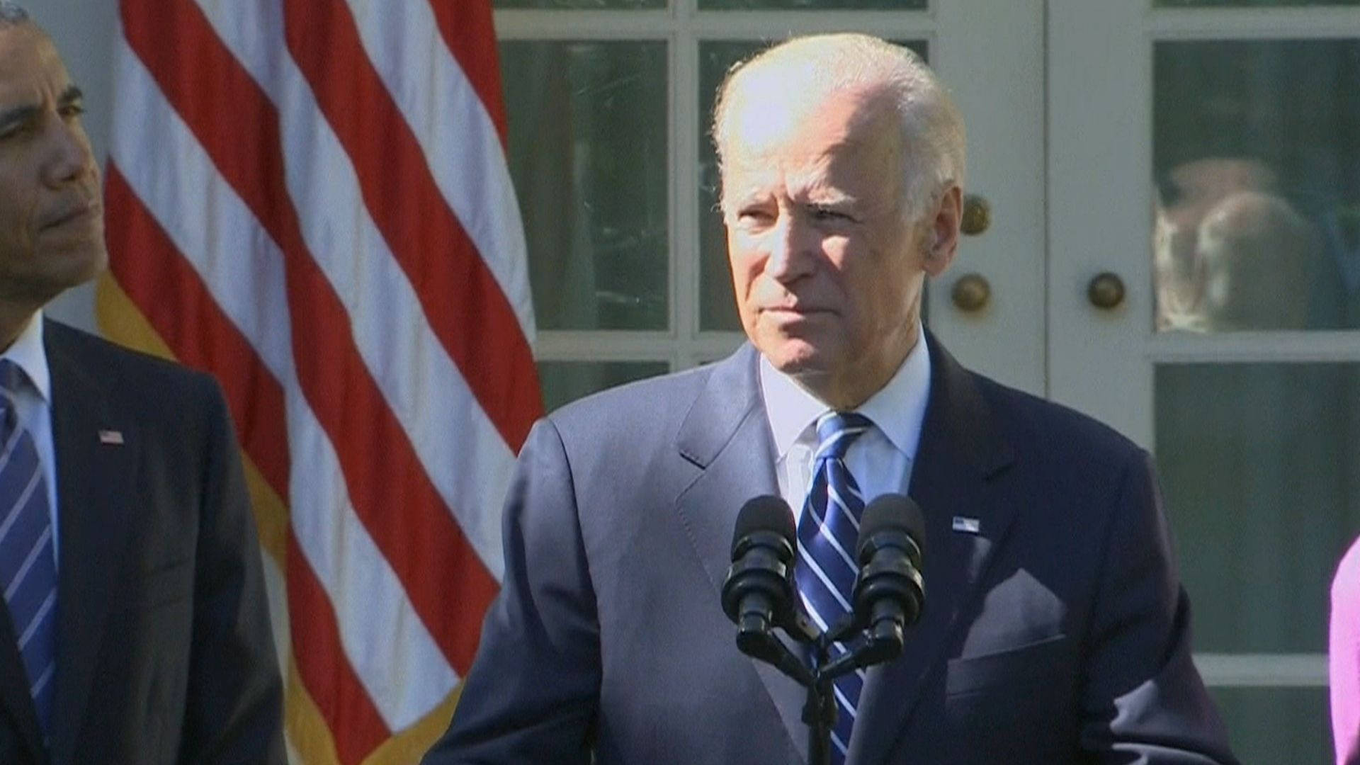 Joe Biden delivers an empowering speech to a crowd in the morning. Wallpaper