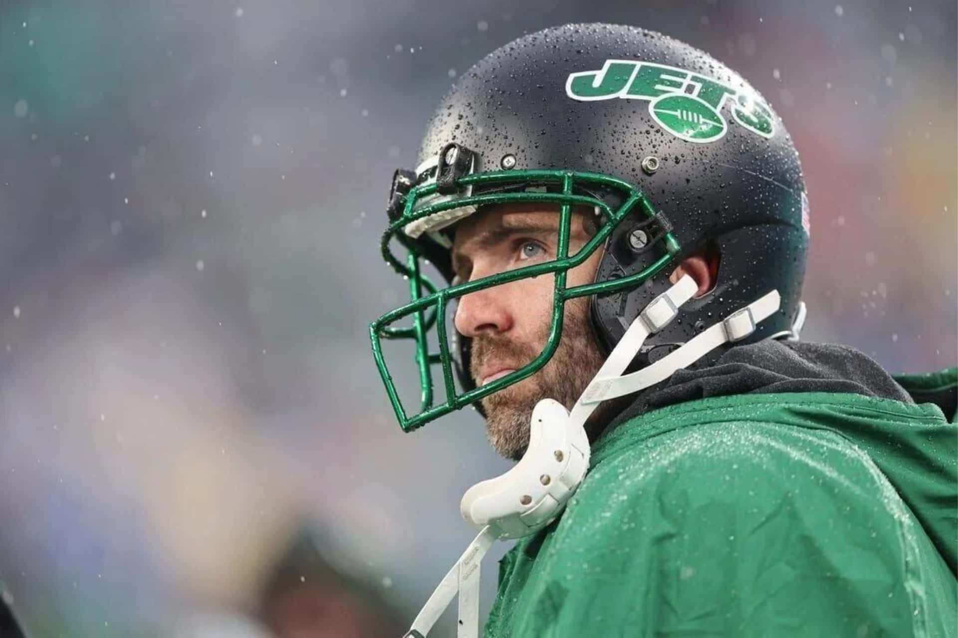 Joe Flaccoin Jets Helmet During Snowy Game Wallpaper