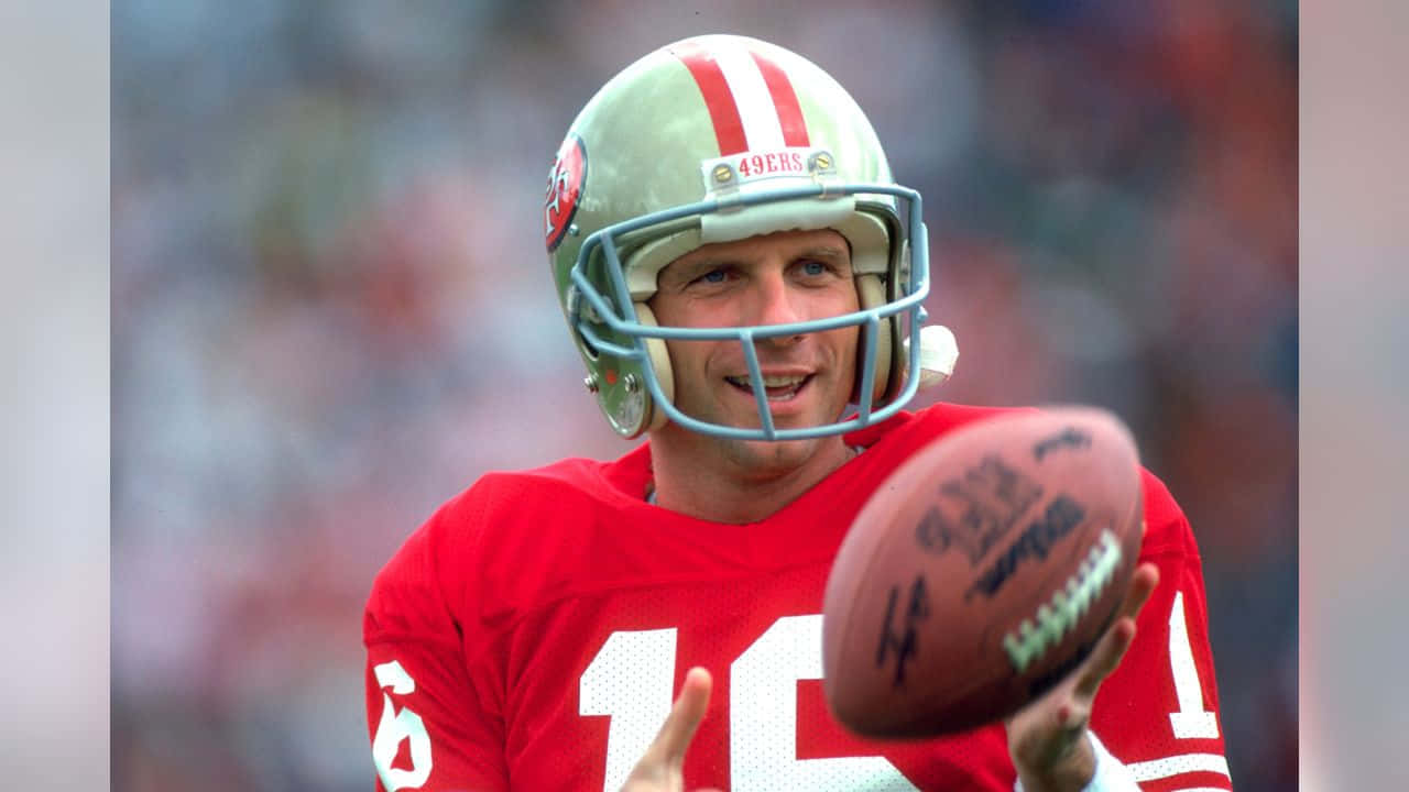 Legendarisk quarterback Joe Montana dekorerer dette tapet. Wallpaper