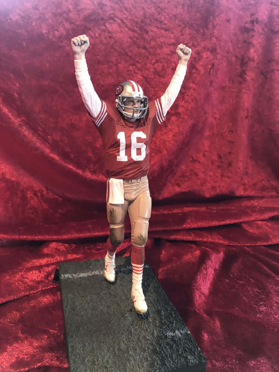 Joe Montana stands proudly with the San Francisco 49ers Wallpaper