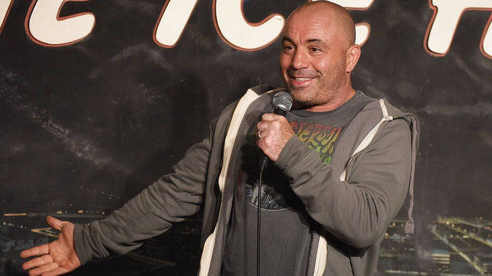 Joe Rogan - Comedian and Podcast Host in Action Wallpaper