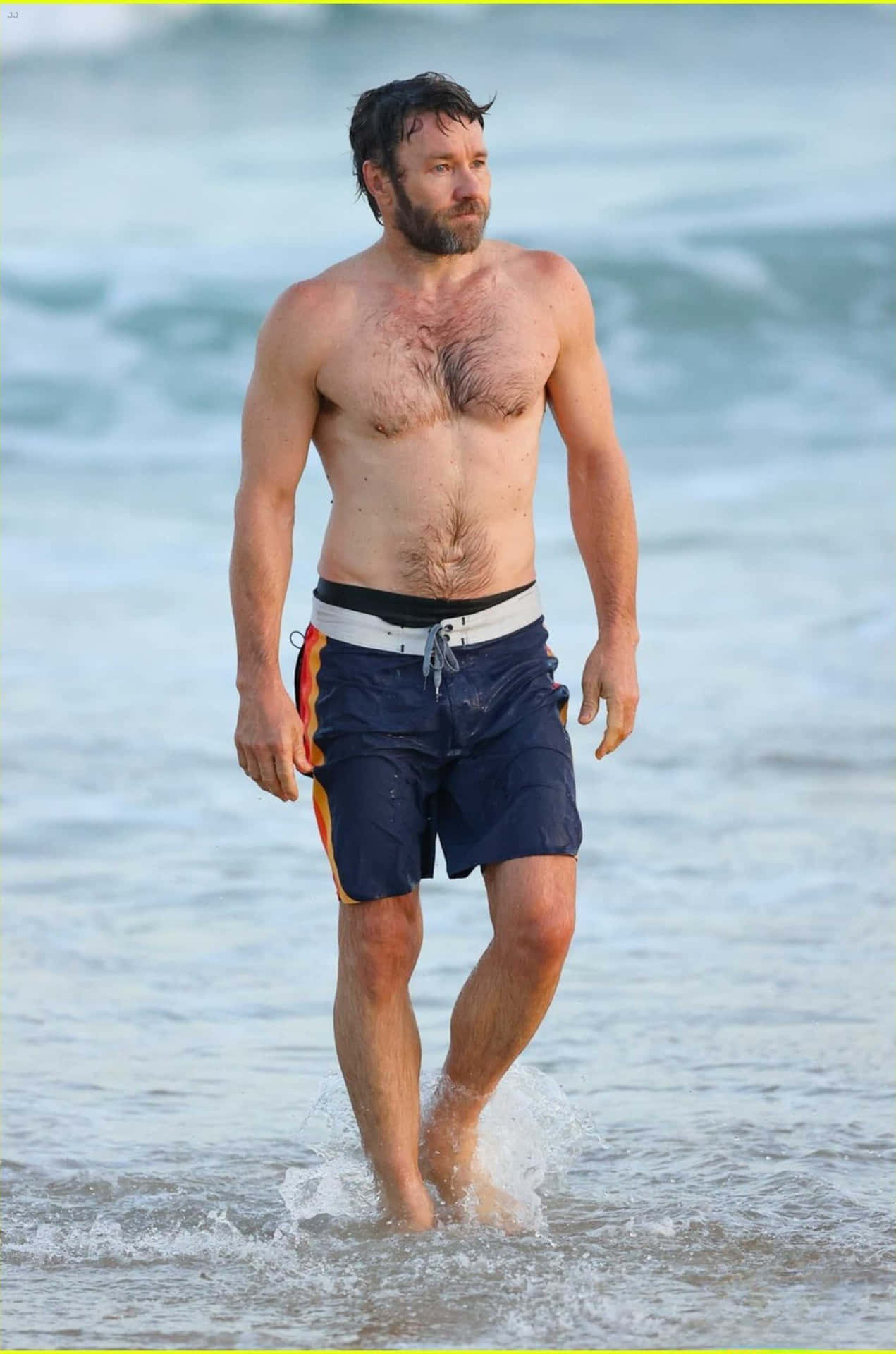 Download Joel Edgerton Beach Stroll Wallpaper | Wallpapers.com