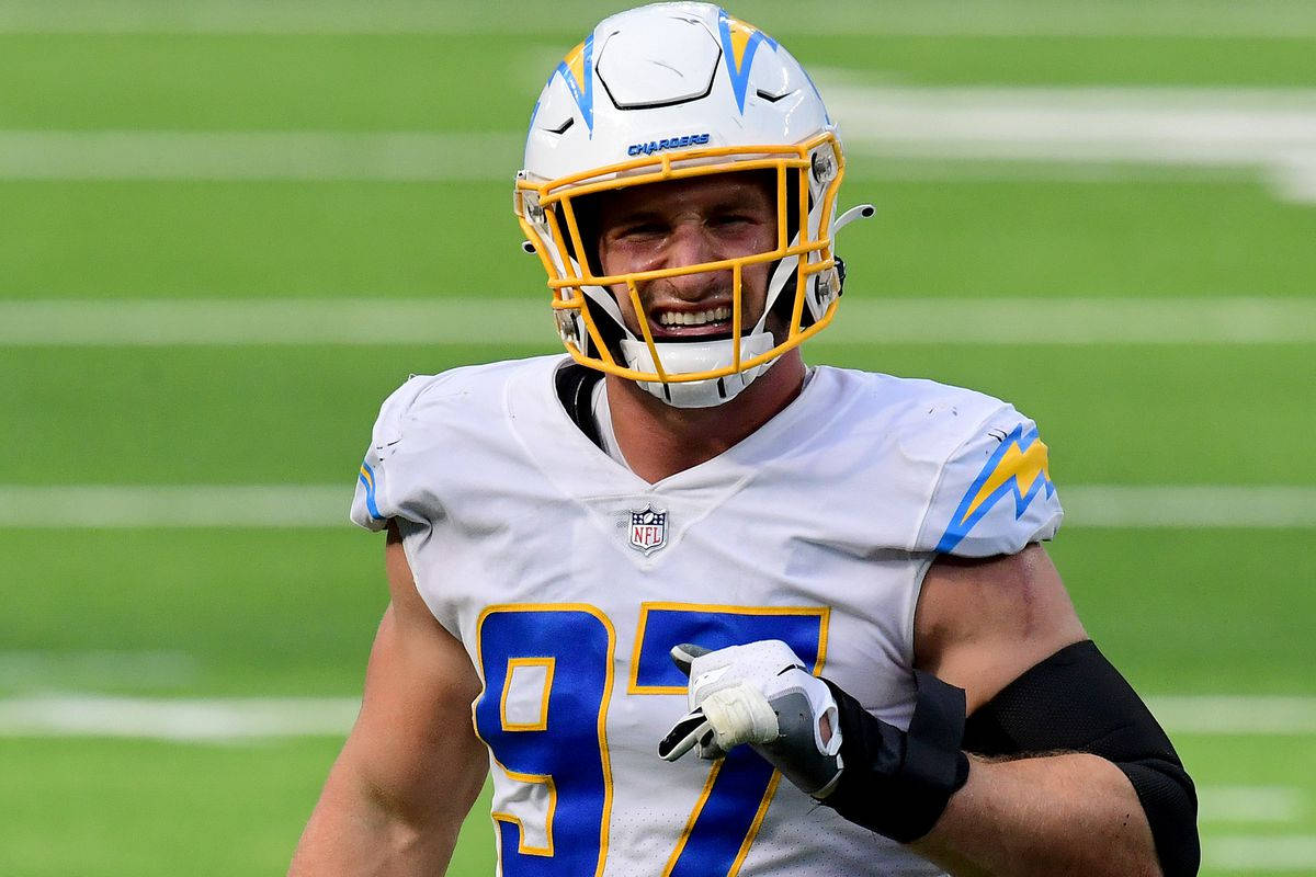 Joey Bosa hold Los Angeles Chargers Wallpaper
