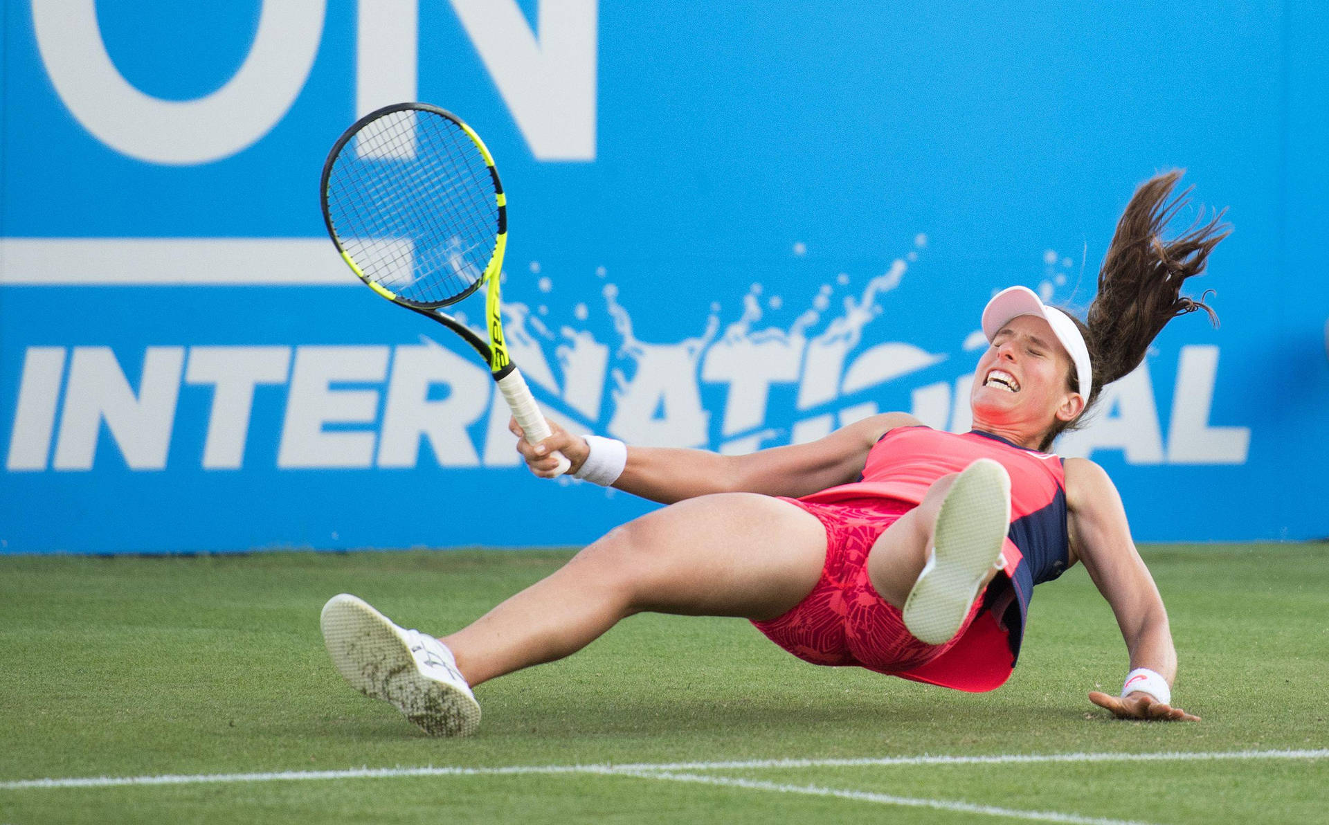 Professional Tennis Player Johanna Konta Trips on Court Wallpaper