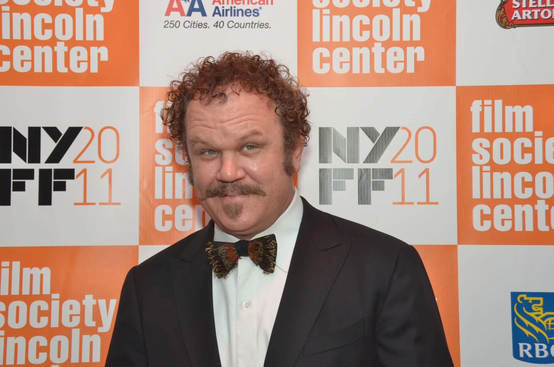 John C. Reilly striking a perfect pose at an event Wallpaper