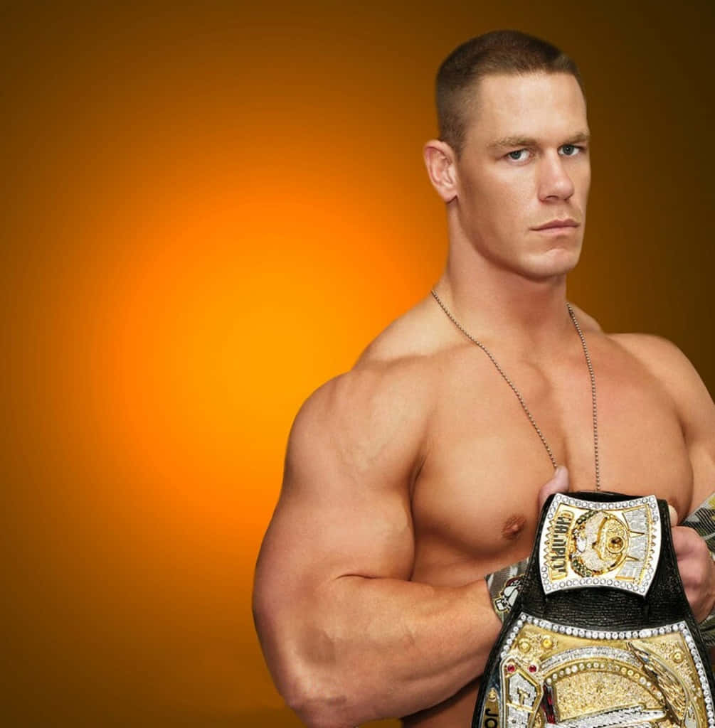 Download John Cena striking a confident pose in the ring | Wallpapers.com