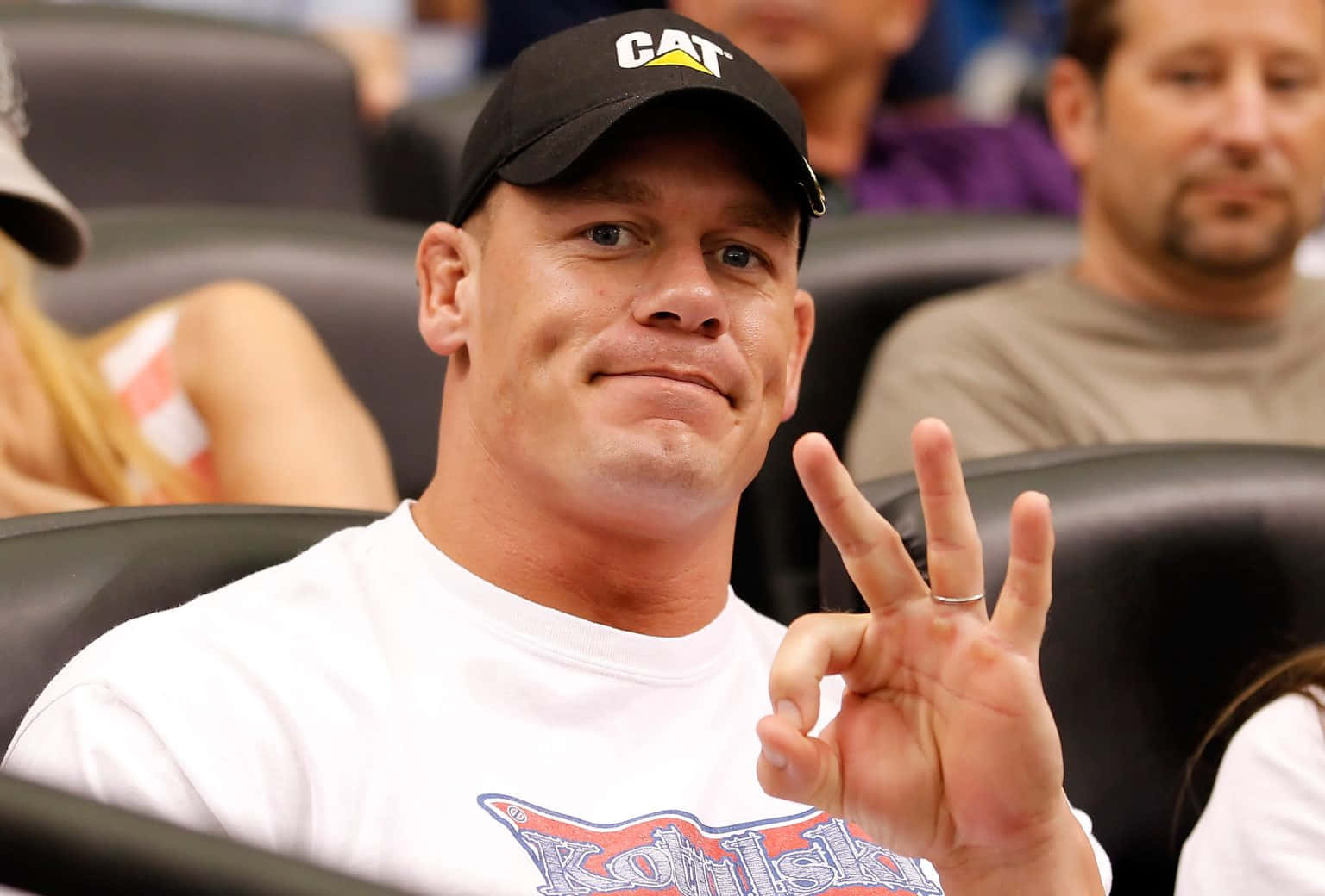 John Cena striking a pose at WWE event.