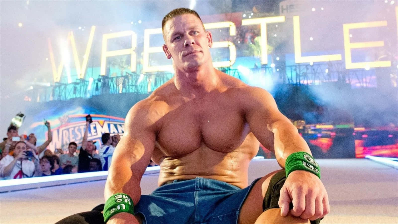 John Cena striking an action pose during a WWE event