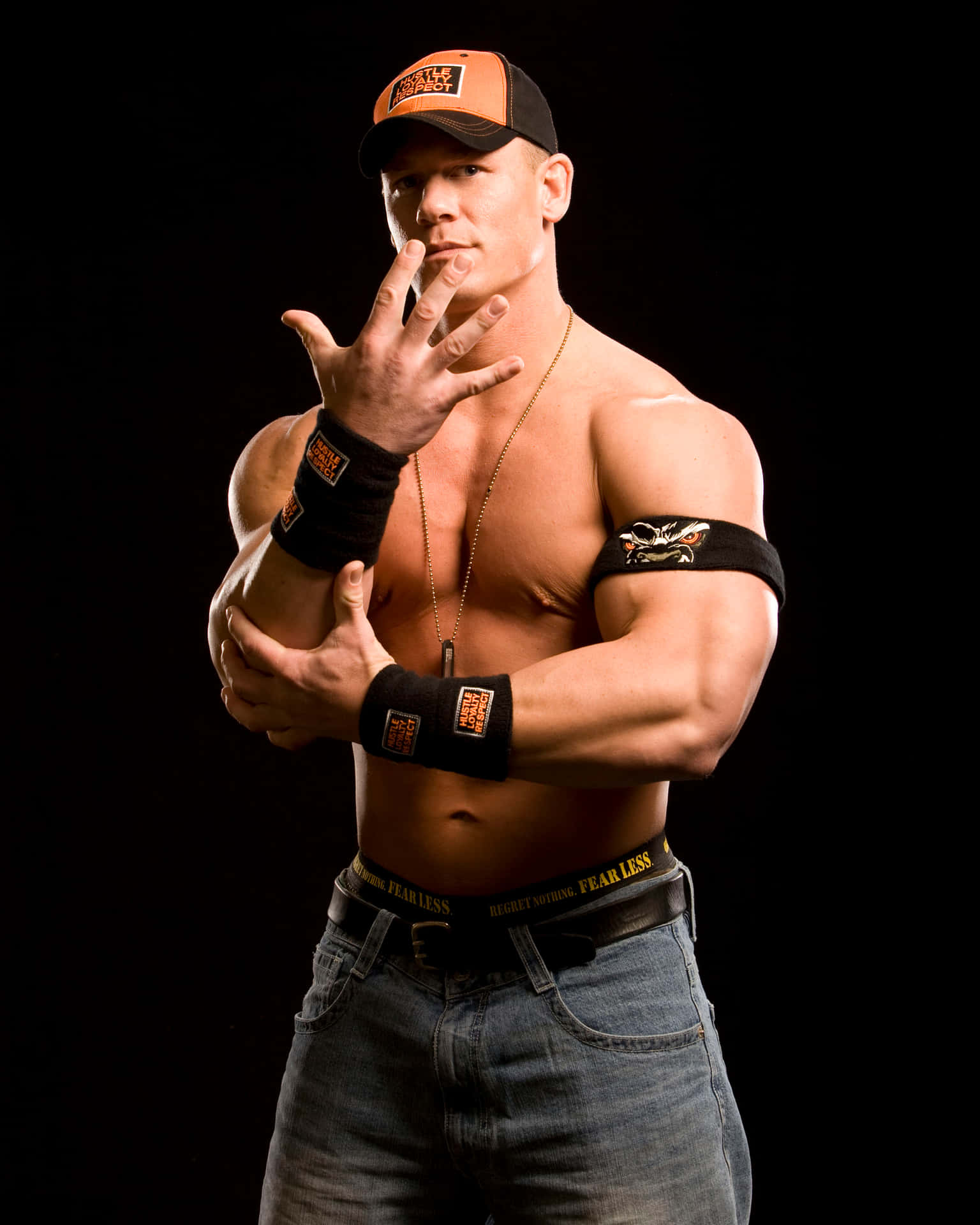 Download John Cena flexing muscles during a WWE match | Wallpapers.com