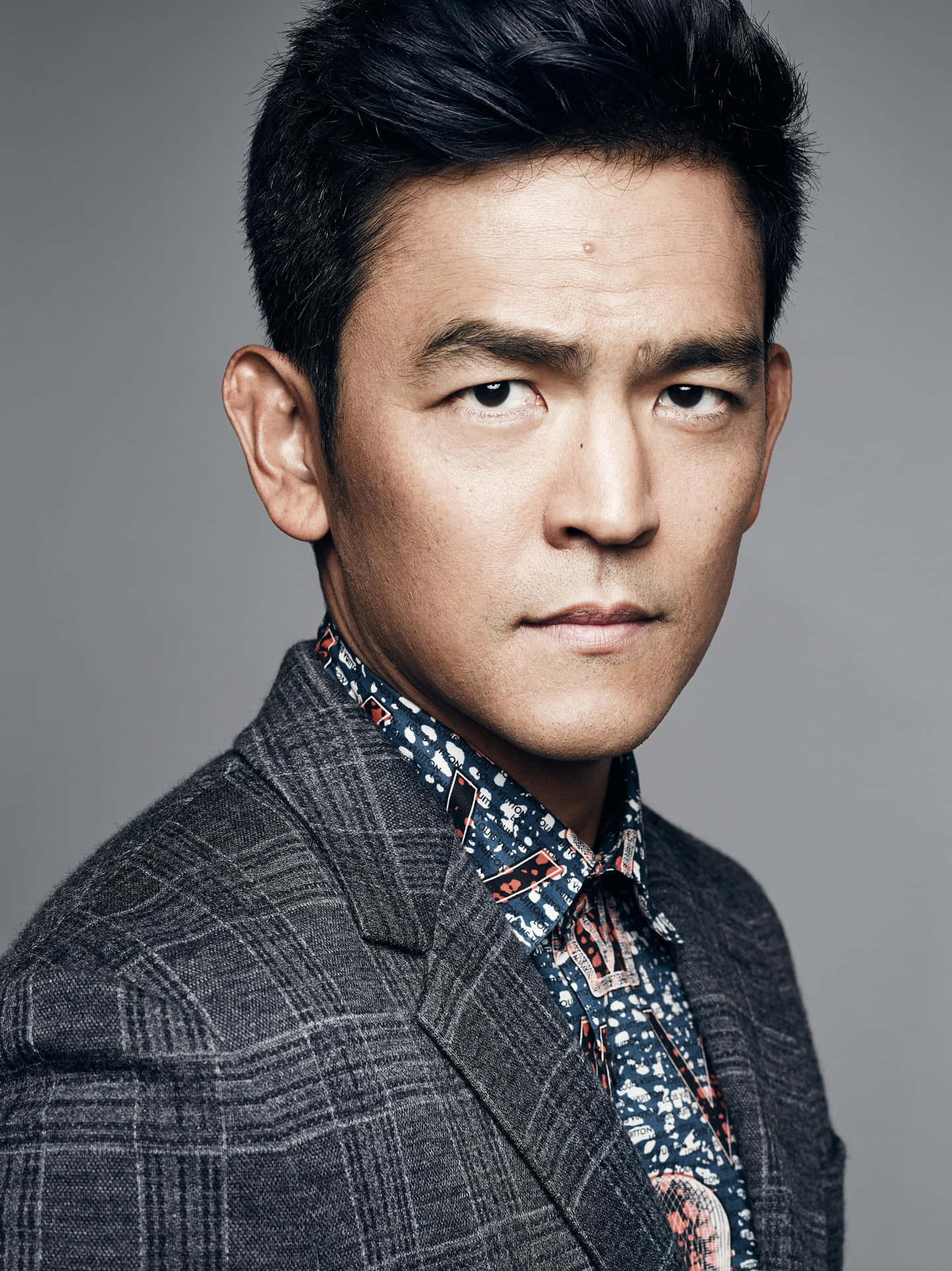 John Cho looking sharp in a gray suit Wallpaper