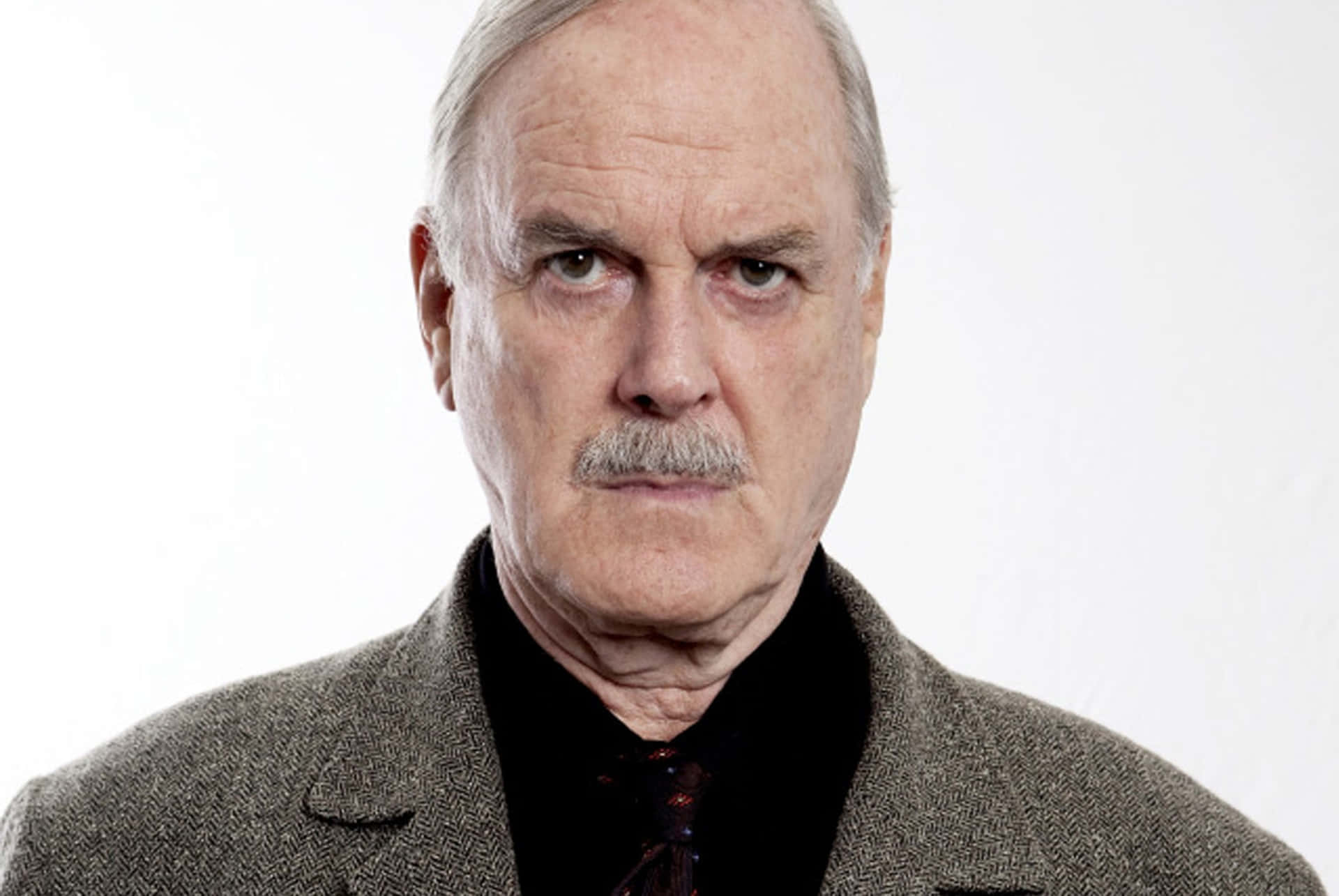 John Cleese In A Classic Comedic Pose. Wallpaper