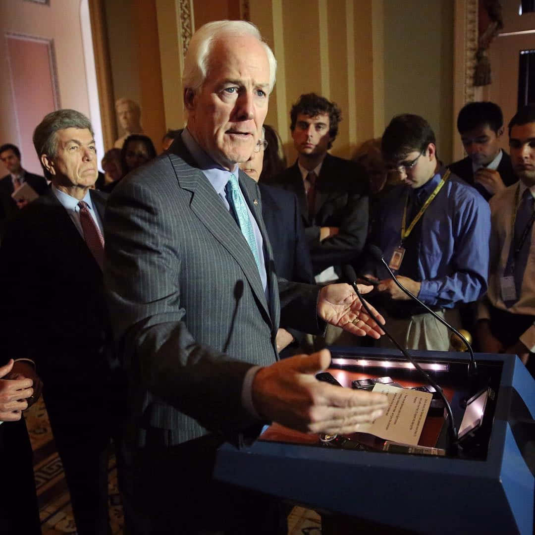 John Cornyn Being Surrounded By Reporters Wallpaper