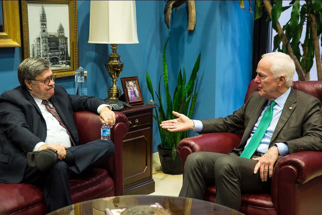 Senator John Cornyn engaged in an informal discussion with a colleague Wallpaper