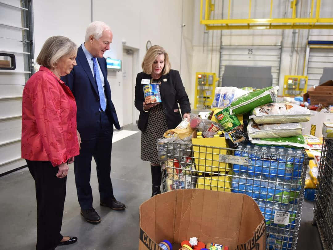 John Cornyn Looking At The Relief Goods Wallpaper