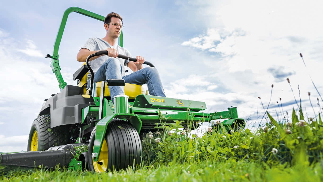 "A John Deere tractor in a lush green field"