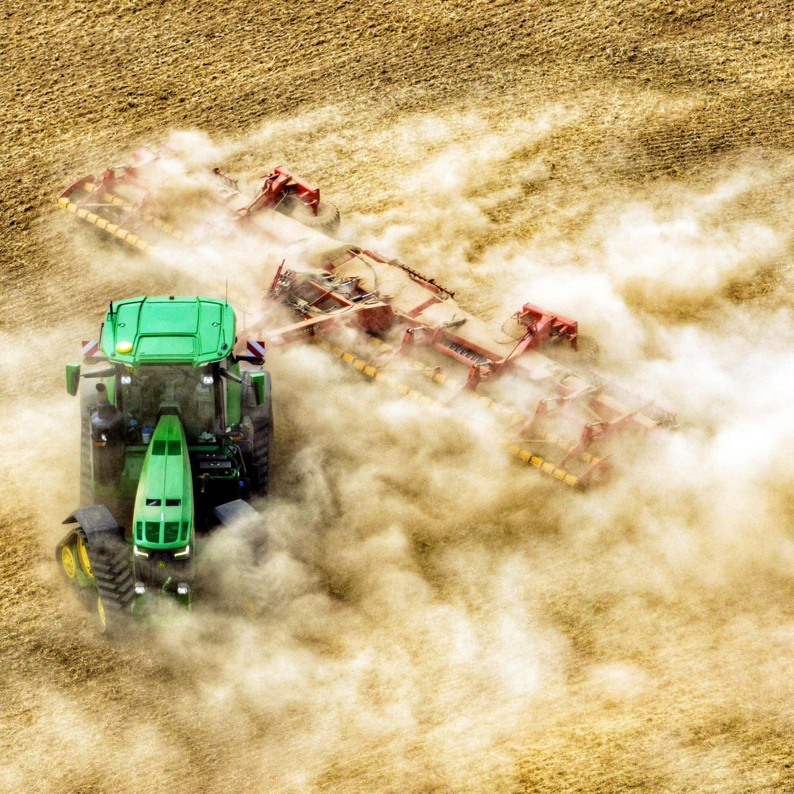 John Deere tractor amidst a beautiful countryside landscape