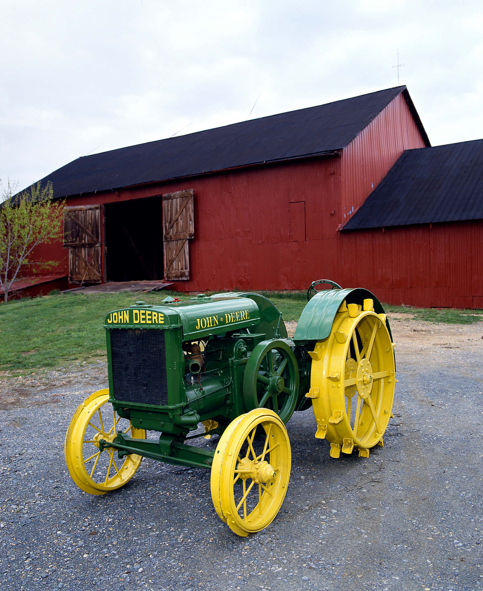 A close-up view of a classic John Deere tractor in the field