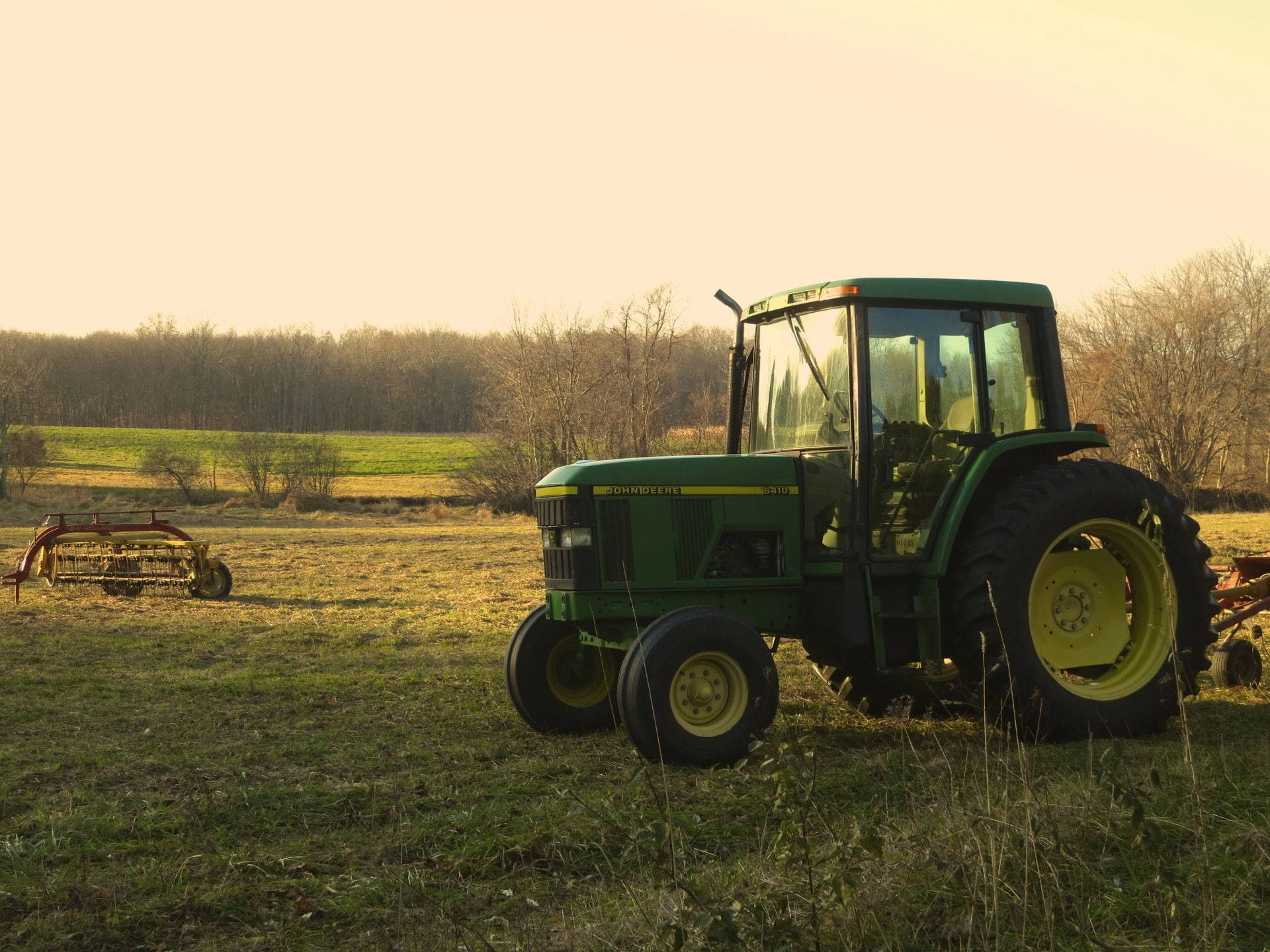 John Deere Tractor In Sunset Field