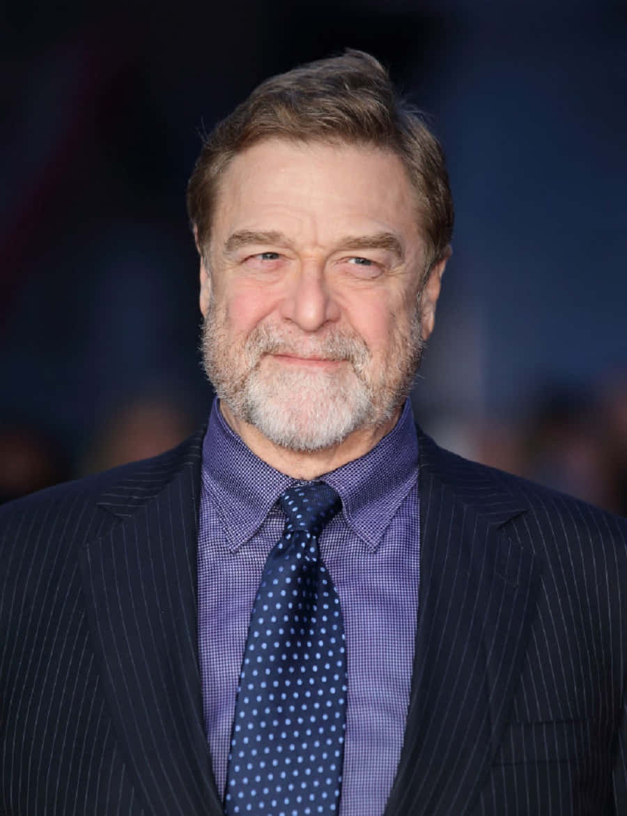 John Goodman Smiling in a Suit Wallpaper