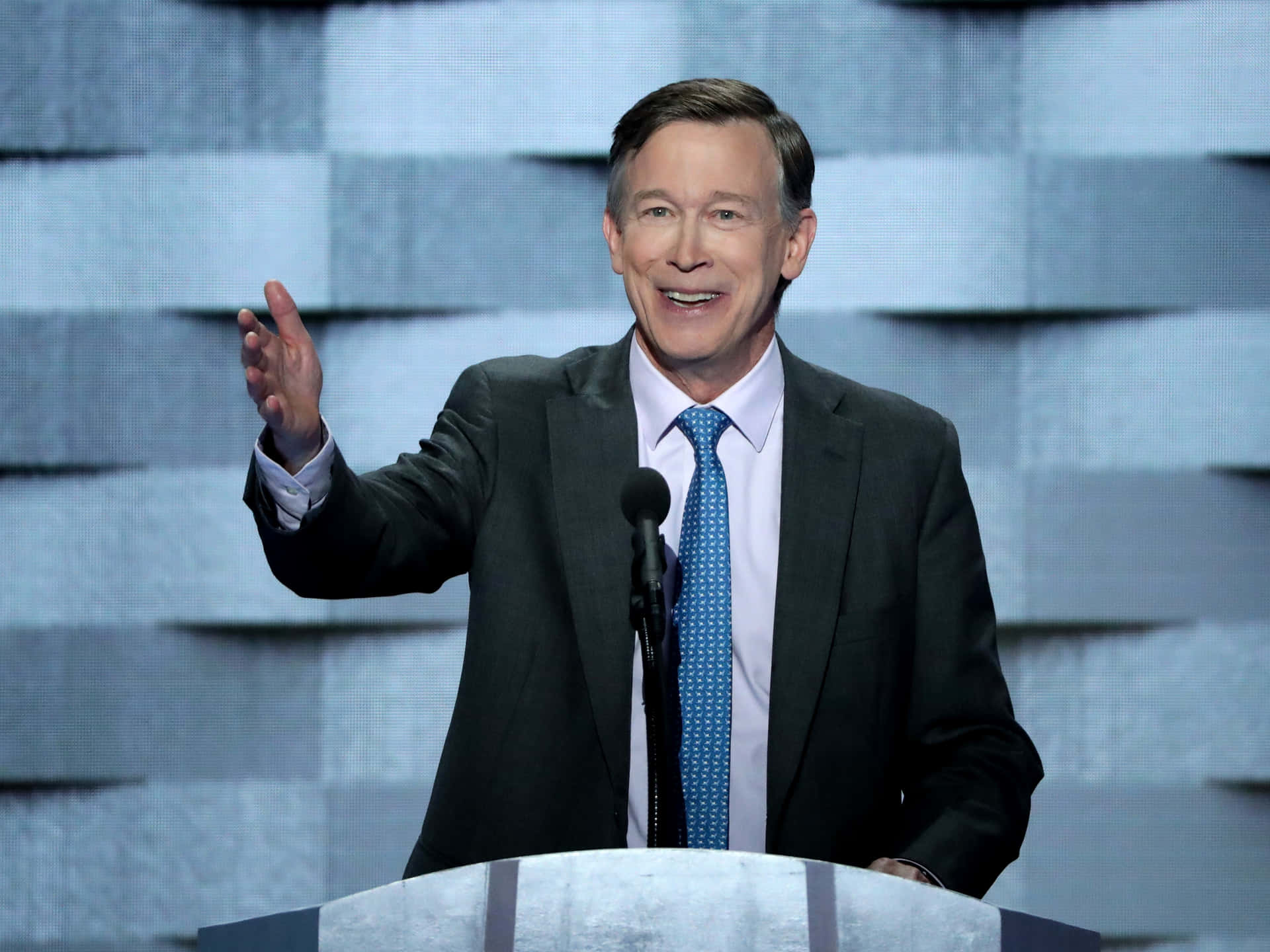 John Hickenlooper Smiling And Addressing The Crowd Wallpaper