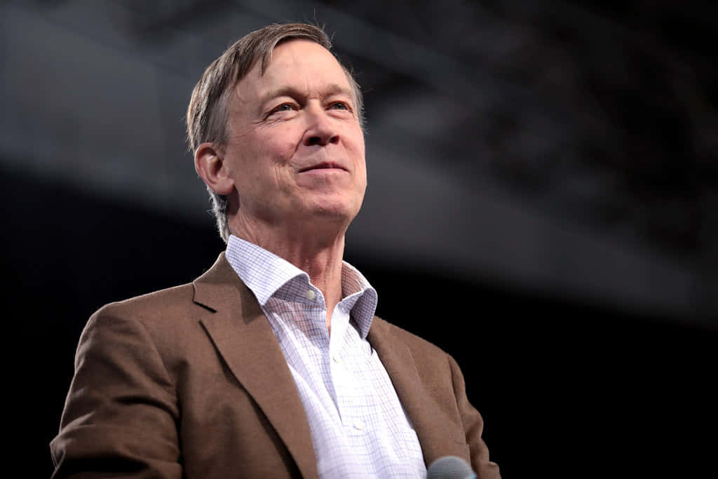John Hickenlooper With A Black And Gray Backdrop Wallpaper