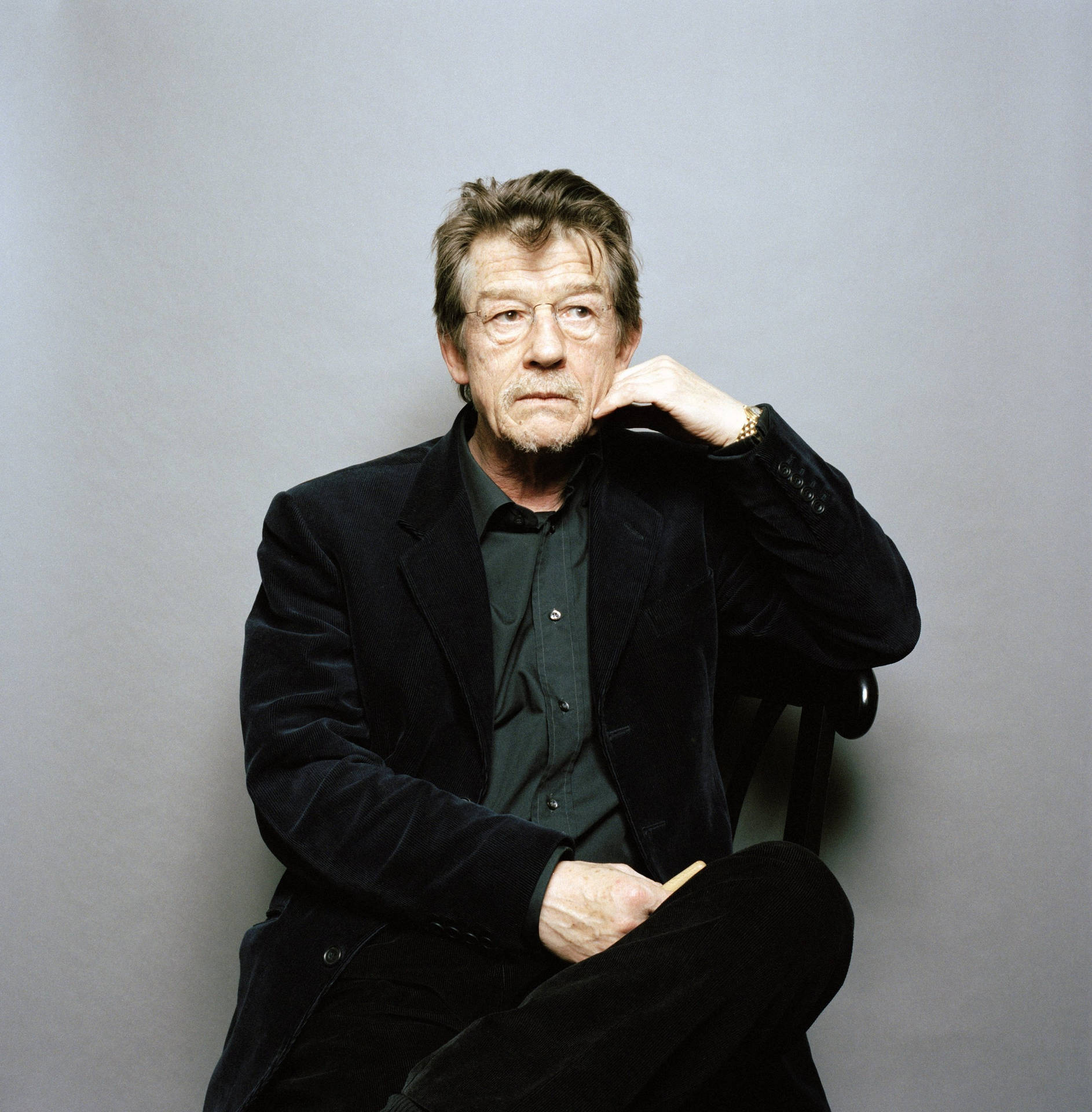 John Hurt Posing On Gray Background Wallpaper