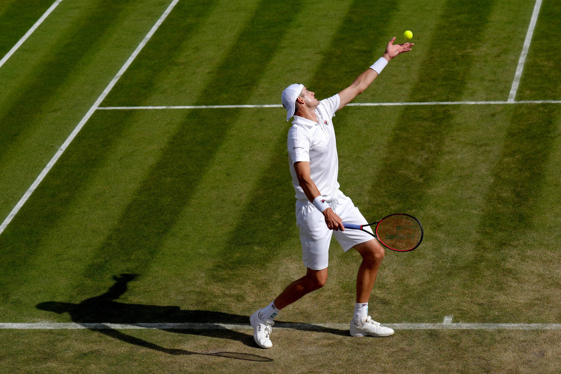 Johnisner Ball Toss May Refer To A Specific Image Or Wallpaper Depicting John Isner, A Professional Tennis Player, During His Ball Toss Motion Before Serving. Sfondo