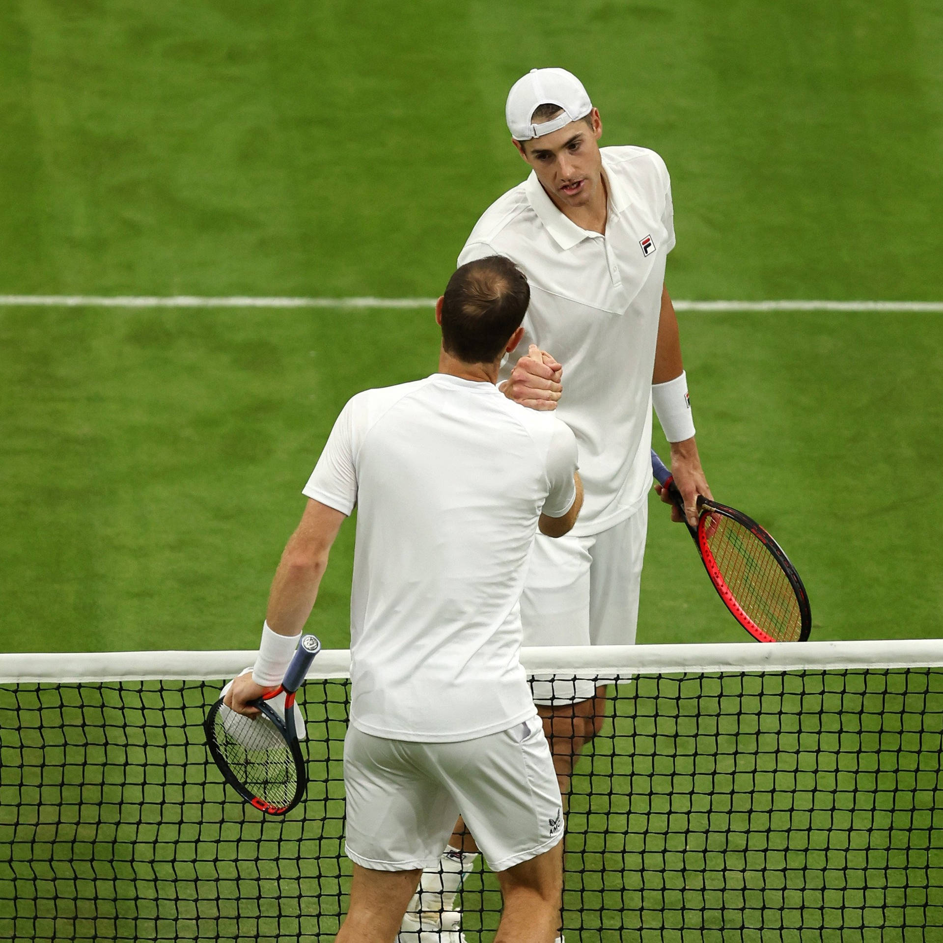 American Tennis Star John Isner Showcasing True Sportsmanship On The Court Wallpaper