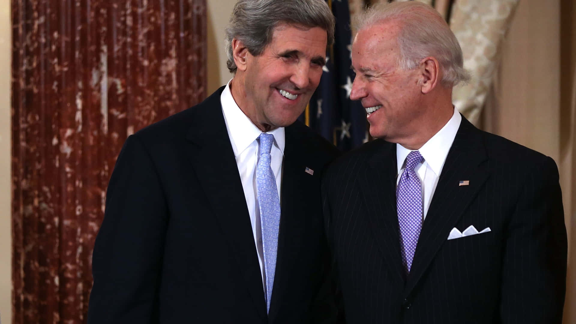 John Kerry And Joe Biden Smiling Wallpaper